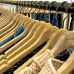 knit and jean clothing on hangers